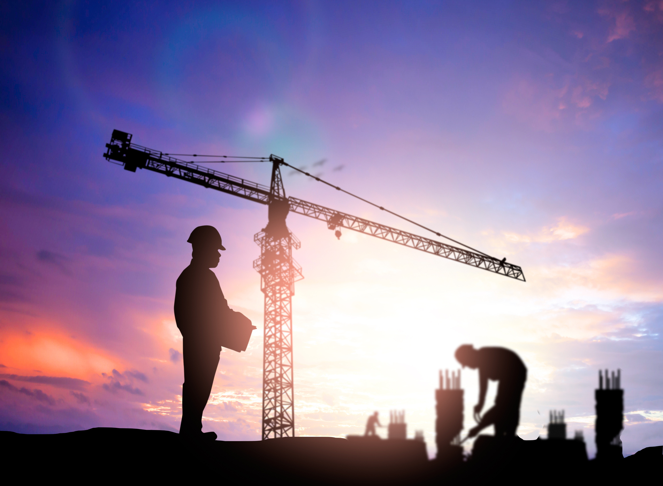 silhouette engineer looking blurred construction worker on const